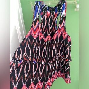 Never worn. Racerback zip front top.